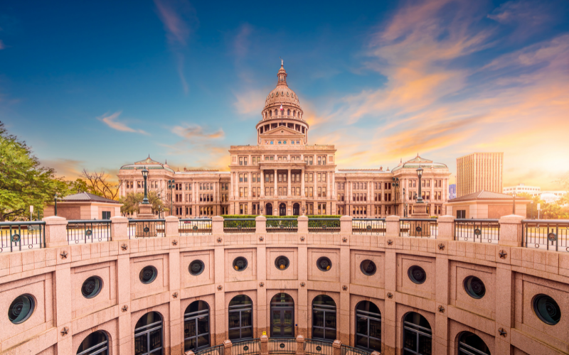 Outside facing view of the Texas Capitol showing its structure of windows and pillars.